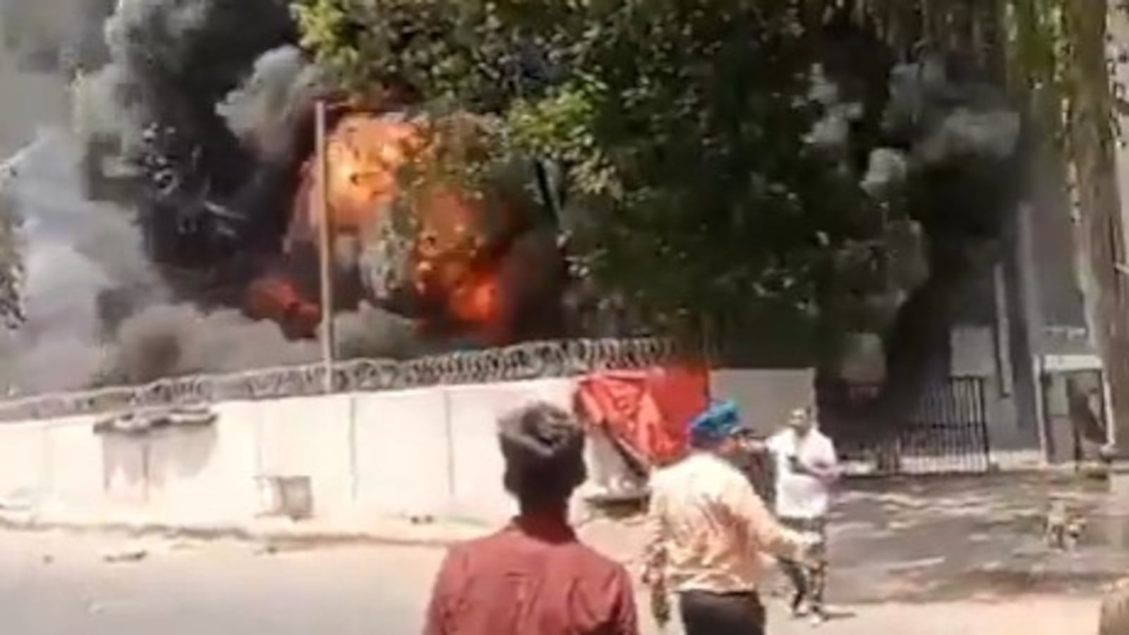 Vishwash Kumar Ramesh (in white t-shirt) seen walking away form the Air India plane crash/