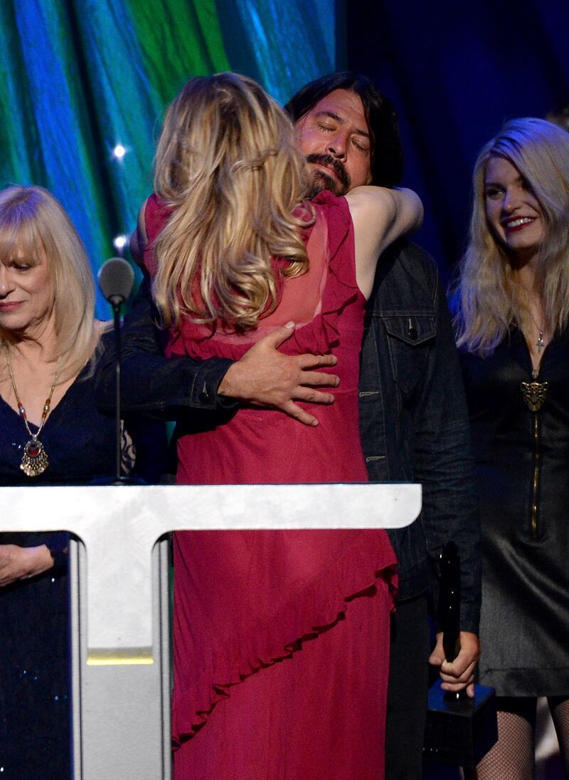 Dave Grohl and Courtney Love pose onstage at the 29th Annual Rock And Roll Hall Of Fame Induction Ceremony at Barclays Center of Brooklyn on April 10, 2014, in New York City.