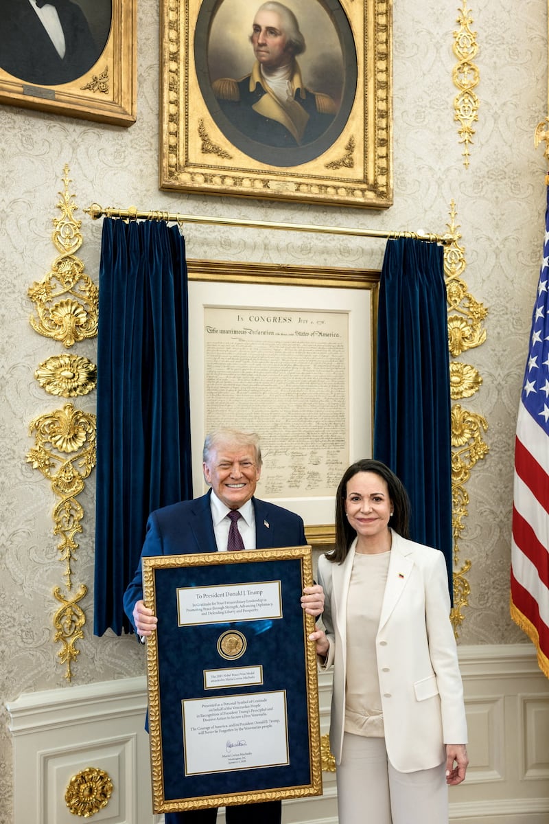 U.S. President Trump meets with Venezuelan opposition leader Maria Corina Machado in the Oval Office, during which she presented the President with her Nobel Peace Prize, in Washington, D.C, U.S., released January 15, 2026. Daniel Torok/The White House/Handout via REUTERS    THIS IMAGE HAS BEEN SUPPLIED BY A THIRD PARTY     TPX IMAGES OF THE DAY