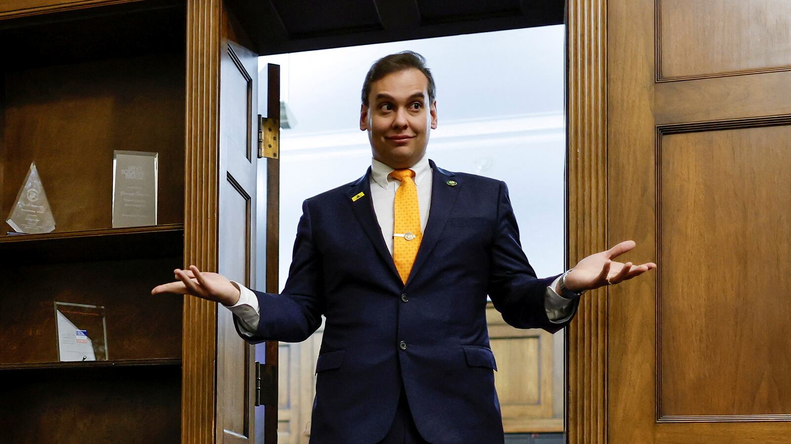 U.S. Representative George Santos (R-NY) chats with his State of the Union guest and members of his staff as they prepare for the evening in Santos’s office on Capitol Hill in Washington.