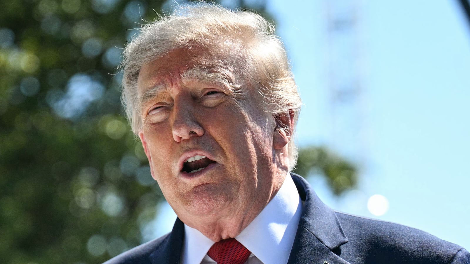 US President Donald Trump speaks to the press about ongoing construction of a helipad and other projects on the South Lawn of the White House in Washington, DC, on August 19, 2026.