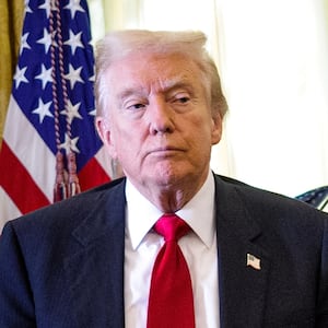 WASHINGTON, DC - NOVEMBER 06: (EDITOR'S NOTE: Alternate Crop) U.S. President Donald Trump stands by as attendees help a guest after he collapsed during during an event on lowering drug prices in the Oval Office at the White House on November 06, 2025 in Washington, DC. Trump announced that his administration has reached agreements with drugmakers Eli Lilly and Novo Nordisk that would lower the price of some GLP-1 weight loss medications. (Photo by Andrew Harnik/Getty Images)