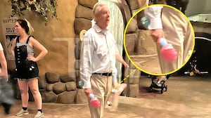 Sen. Lindsey Graham walking with a bubble wand at Disney World.