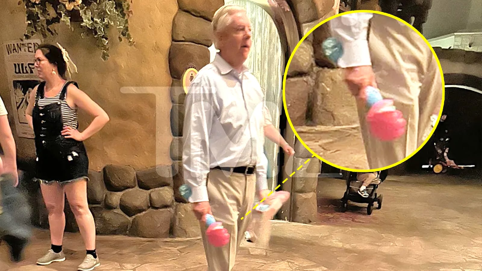 Sen. Lindsey Graham walking with a bubble wand at Disney World.