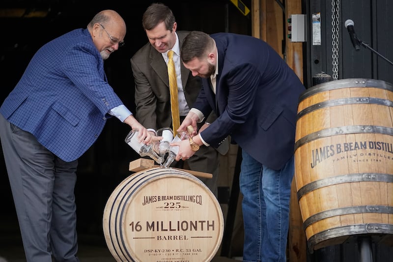 CLERMONT, KY - FEBRUARY 17:  Jim Beam Master Distiller Fred Noe (L), Kentucky Gov. Andy Beshear (C) and Freddie Now, Beam Distiller, fill the distillery's 16 millionth barrel of bourbon at the Jim Beam Distillery on February 17, 2020 in Clermont, Kentucky.  U.S. whiskey exports have fallen by 27 percent to the European Union, the product's largest export market, caused by retaliatory tariffs imposed by the 27-nation alliance, a trade group said last week.  (Photo by Bryan Woolston/Getty Images)