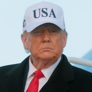 JOINT BASE ANDREWS, MARYLAND - JANUARY 13: U.S. President Donald Trump walks down the air stairs after landing on Air Force One on January 13, 2026 at Joint Base Andrews, Maryland. Trump spent the day in Detroit participating in a tour of the Ford River Rouge complex and speaking at the Detroit Economic Club.  (Photo by Anna Moneymaker/Getty Images)