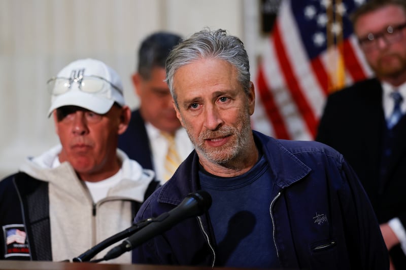 Comedian Jon Stewart, with John Feal, an advocate for first responders, speaks to reporters about their effort to raise awareness for U.S. veterans suffering from illnesses caused by military toxic exposures during a news conference on Capitol Hill