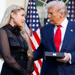 WASHINGTON, DC - OCTOBER 14: U.S. President Donald Trump posthumously awards the Presidential Medal of Freedom to late conservative activist Charlie Kirk as he presents the Medal to his wife Erika Kirk (L) during a ceremony in the Rose Garden of the White House on October 14, 2025 in Washington, DC. Today marks the National Day of Remembrance for Charlie Kirk who was shot and killed on September 10th at Utah Valley University. (Photo by Kevin Dietsch/Getty Images)