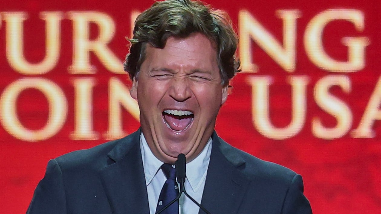 Political commentator Tucker Carlson speaks during the memorial service for political activist Charlie Kirk at State Farm Stadium on September 21,