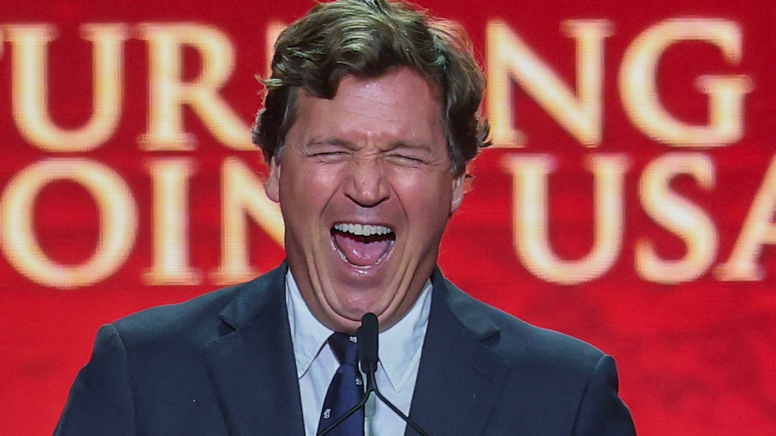 Political commentator Tucker Carlson speaks during the memorial service for political activist Charlie Kirk at State Farm Stadium on September 21,