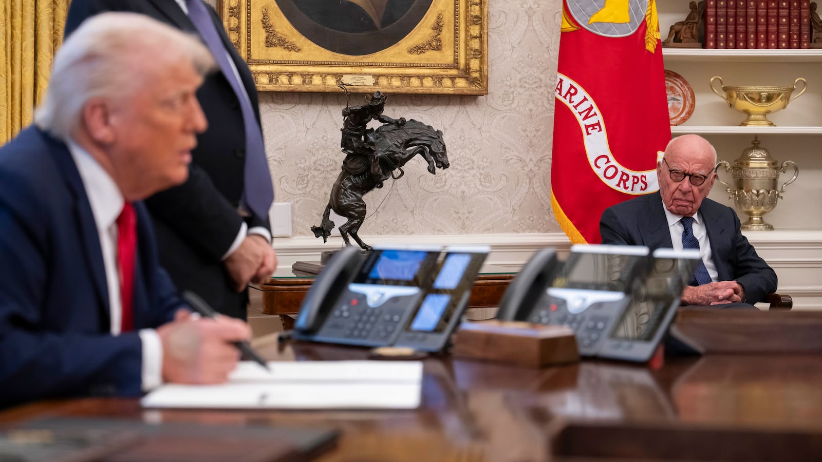 Media mogul Rupert Murdoch looks on as President Donald Trump speaks to members of the media as he signs proclamations, initiatives and appointments inside the Oval Office at the White House in Washington, DC on February 03, 2025.