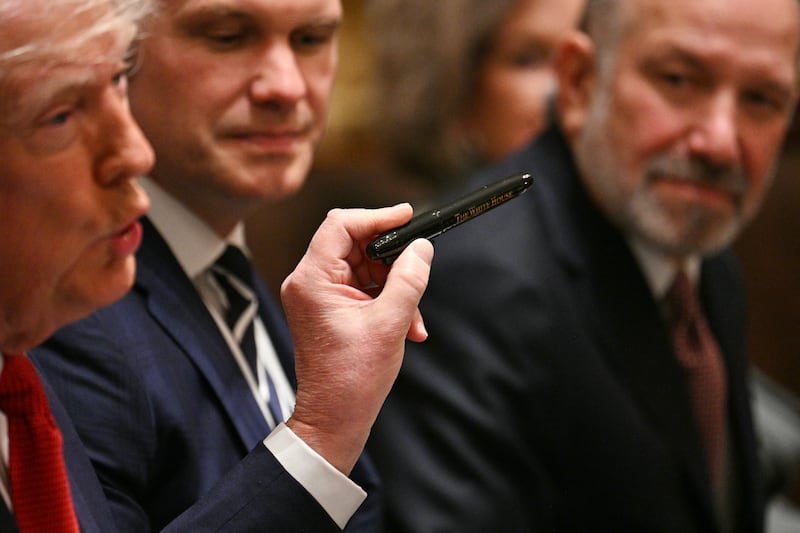 President Donald Trump speaks holds a pen as he speaks during a cabinet meeting in the Cabinet Room of the White House on March 26, 2026 in Washington, DC.