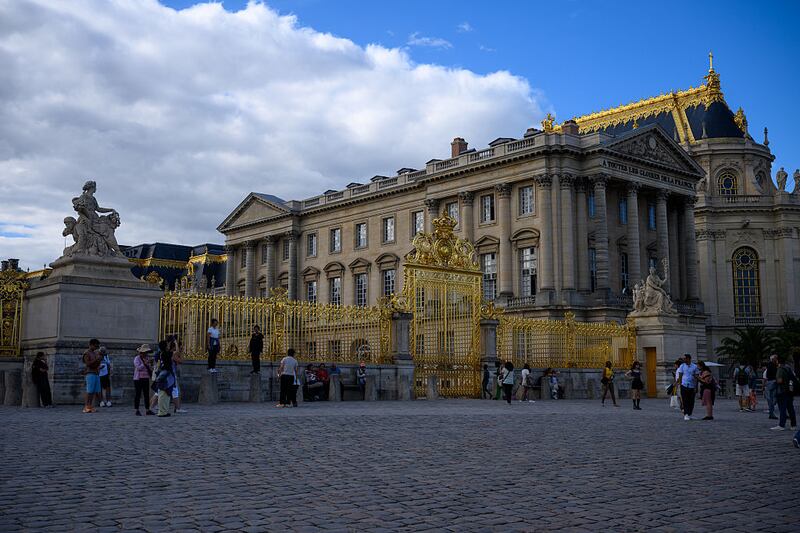 A view of the gates at Château de Versailles on August 28, 2025 in Versailles, France. The Palace was originally built as a hunting lodge in 1623 by King Louis XIII. His successor Louis XIV expanded the chateau into a palace in several phases from 1661 to 1715.
