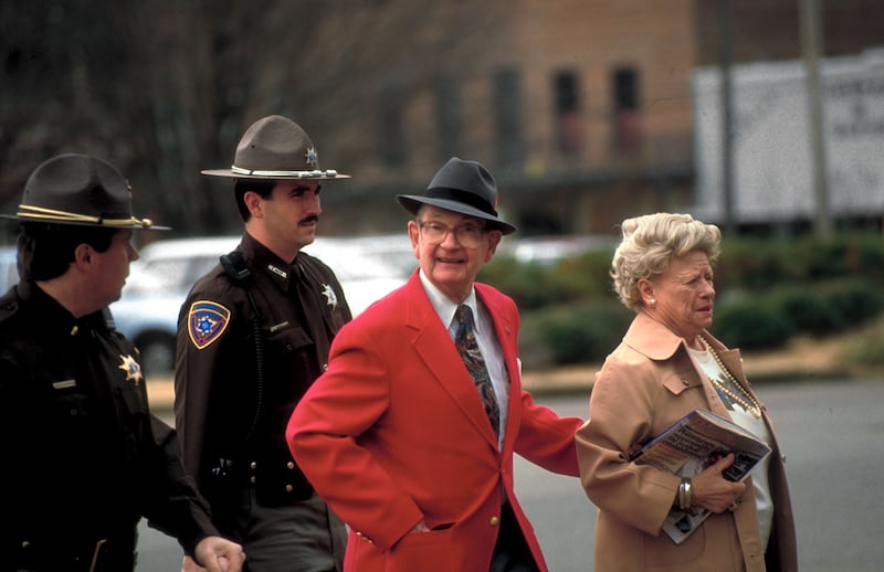 State troopers escorting Byron de la Beckwith and his wife to court during his 3rd trial for the 1963 murder of civil rights activist Medgar Evers.