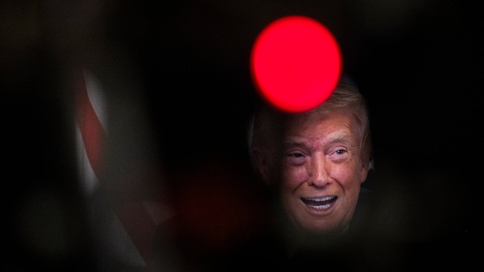 President Donald Trump participates in a call with U.S. service members from his Mar-a-Lago club