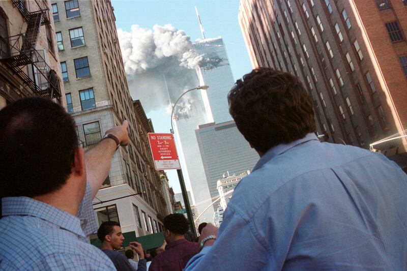 Pedestrians react to the World Trade Center collapse September 11,
2001.