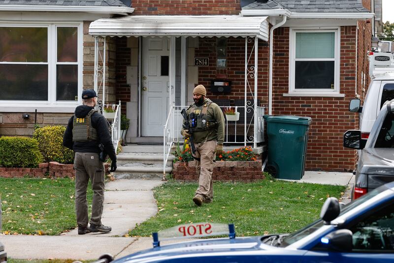 Members of the FBI Joint Terrorism Task Force search a home in Dearborn, Michigan, on October 31, 2025. FBI Director Kash Patel said Friday that the agency had thwarted a "potential terrorist attack" planned in the northern state of Michigan over Halloween weekend. Patel said the FBI arrested multiple subjects. (Photo by JEFF KOWALSKY / AFP) (Photo by JEFF KOWALSKY/AFP via Getty Images)