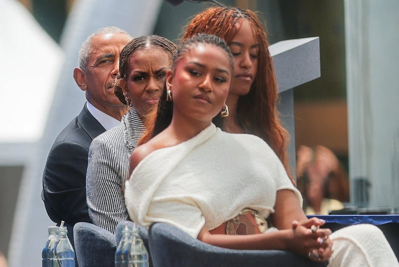 Former U.S. President Barack Obama, his wife, former first lady Michelle Obama and their daughters Malia Obama and Sasha Obama attend the dedication ceremony for the opening of the Obama Presidential Center in Chicago, Illinois, U.S., June 18, 2026.