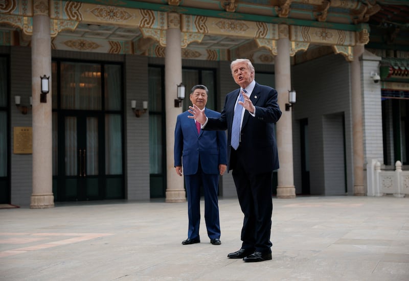 U.S. President Donald Trump gestures as he speaks next to Chinese President Xi Jinping during a visit to the  Zhongnanhai Garden in Beijing, China, May 15, 2026.