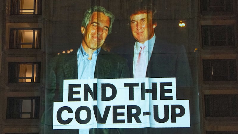 A photo of late financier and convicted sex offender Jeffrey Epstein and U.S. President Donald Trump is projected onto the Washington Hilton in Washington, D.C., U.S., April 24, 2026. REUTERS/Aaron Schwartz