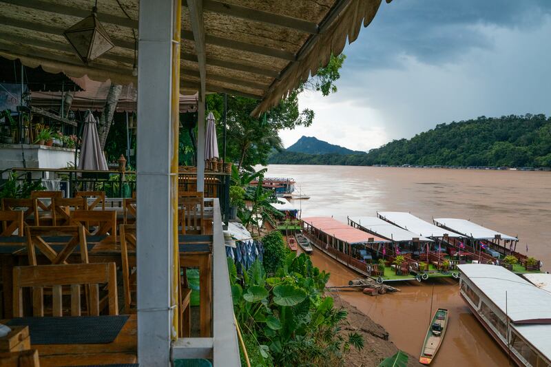 LUANG PRABANG, LAOS - AUGUST 8: Boats on the Mekong River in Luang Prabang as seen on August 8, 2025. Trump administration is set to introduce significant tariff adjustments, with Laos facing U.S. tariffs of 40% alongside stricter visa regulations. These measures are likely to further open the Lao market to increased influence from China, which already maintains a substantial presence in the country. (Photo by Magdalena Chodownik/Anadolu via Getty Images)