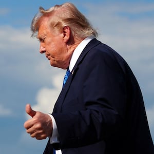 Donald Trump flashes a thumbs up