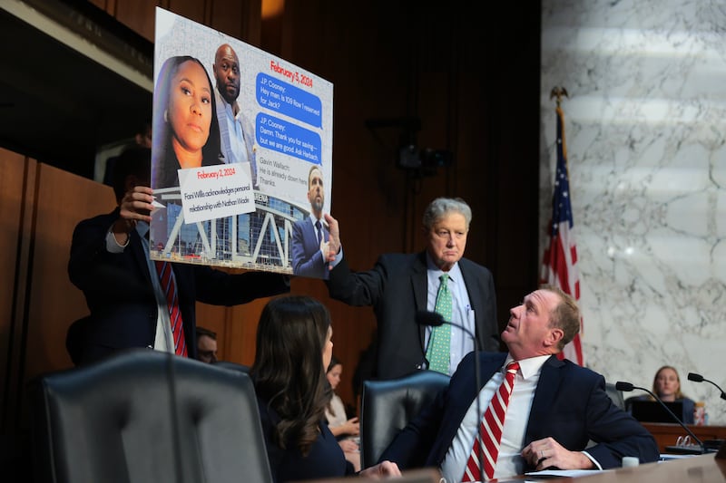 Sen. Eric Schmitt displayed a sign accusing former Special Counsel Jack Smith of meeting with Fulton County, Georgia, District Attorney Fani Willis during a hearing before the Senate Judiciary Committee in the Hart Senate Office Building on September 29, 2026, but the references in the text messages were not about attending an Atlanta Hawks game but an Iowa Hawkeyes game in Maryland.