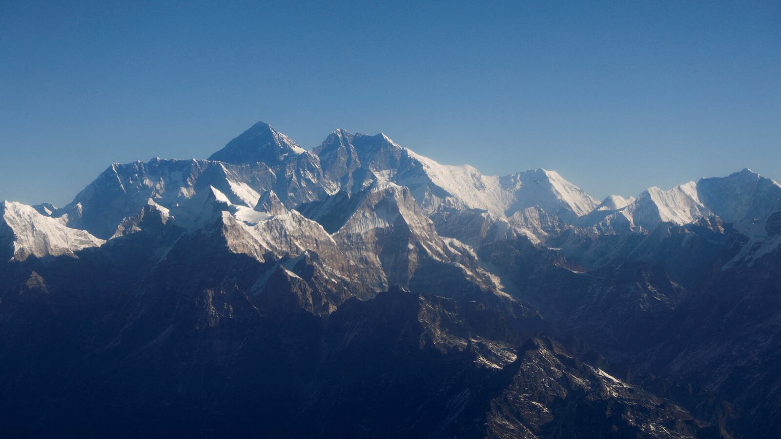 Mount Everest, the world highest peak, and other peaks of the Himalayan range are seen through an aircraft window during a mountain flight from Kathmandu, Nepal January 15, 2020.