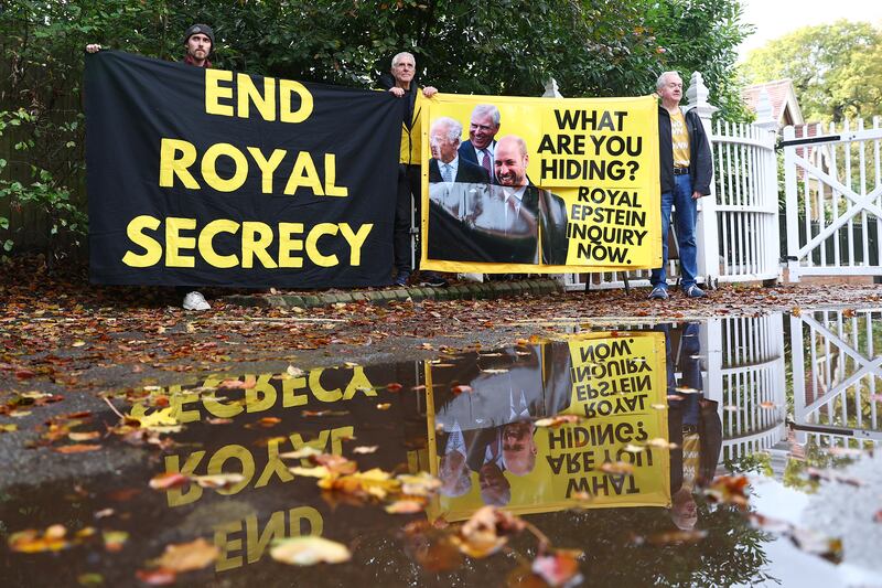 WINDSOR, ENGLAND - OCTOBER 21: Activists from the anti-monarchy group Republic, stage a protest at the entrance to Windsor Great Park and Royal Lodge where Prince Andrew lives on October 21, 2025 in Windsor, England. In a statement Prince Andrew confirmed that he will no longer use his royal titles or honours following continued accusations relating to his links to Jeffrey Epstein. (Photo by Peter Nicholls/Getty Images)