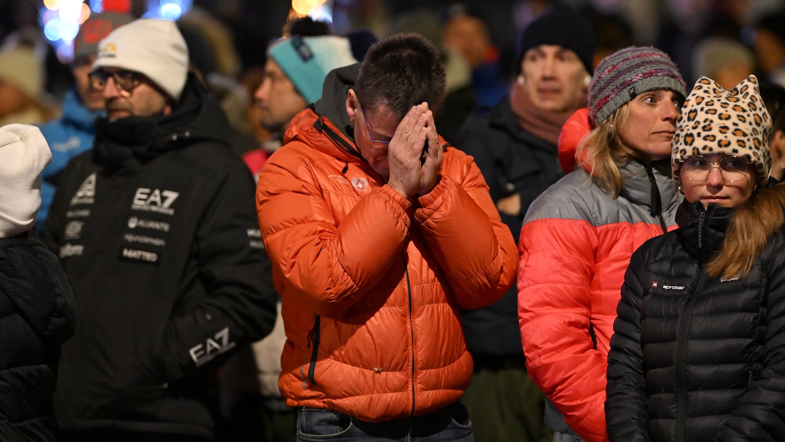 Mourners gather to leave flowers and candles at the scene after a fire broke out overnight at Le Constellation bar on January 01, 2026 in Crans-Montana, Switzerland. According to authorities, the fire began around 1:30 AM local time, with reports that 47 people are believed to have died and over a hundred more seriously injured.