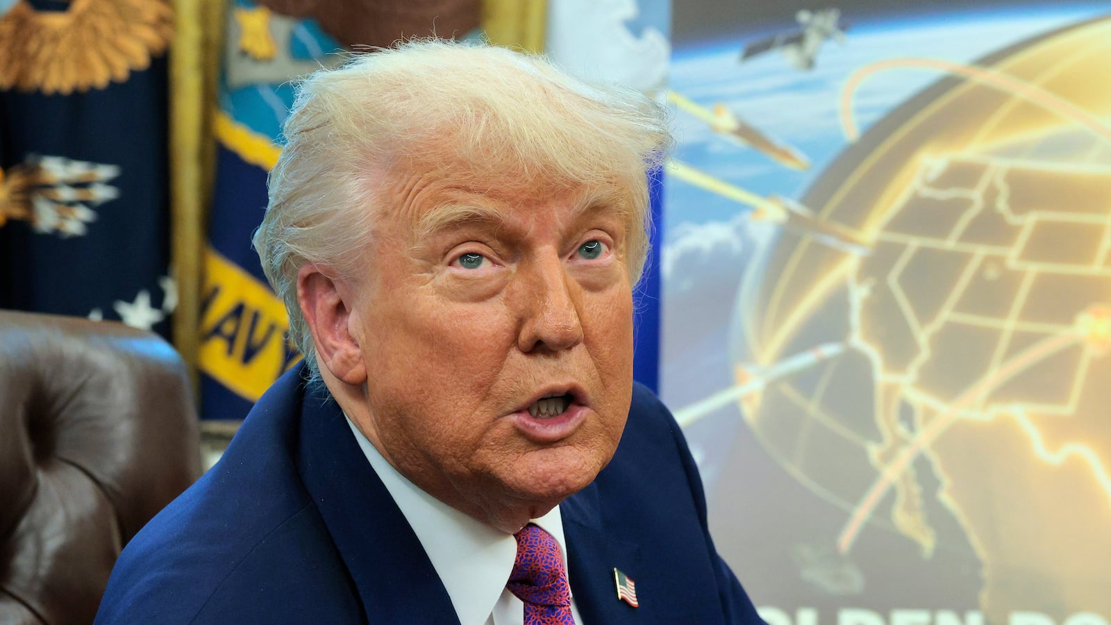 A close-up of President Donald Trump in the Oval Office announcing his plans for a "golden dome" defense system.