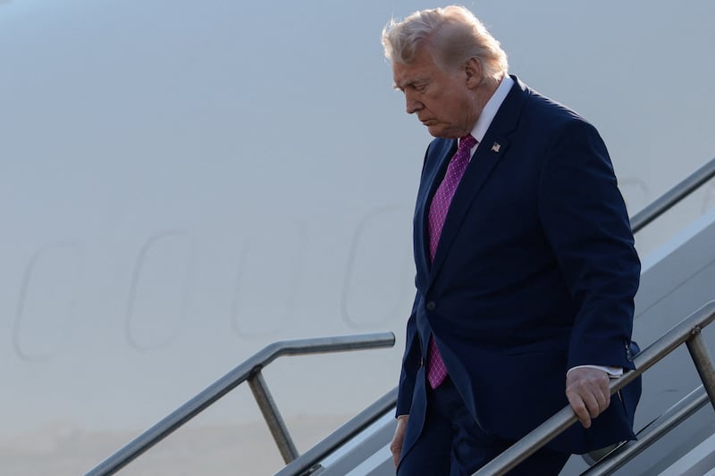 U.S. President Donald Trump disembarks Air Force One, in Charlottesville, Virginia, U.S., April 10, 2026. REUTERS/Evelyn Hockstein