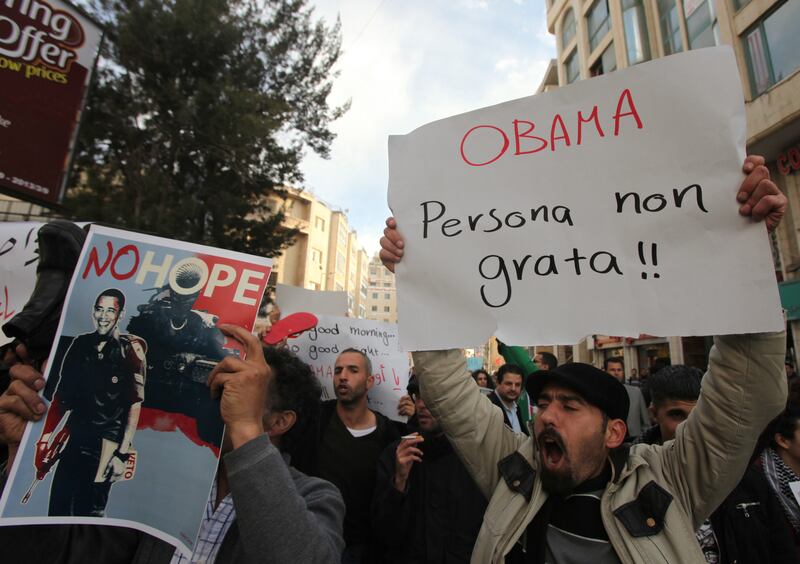articles/2013/03/19/palestinians-protest-obama-s-visit/obama-protest-ramallah-openz_snkoe1