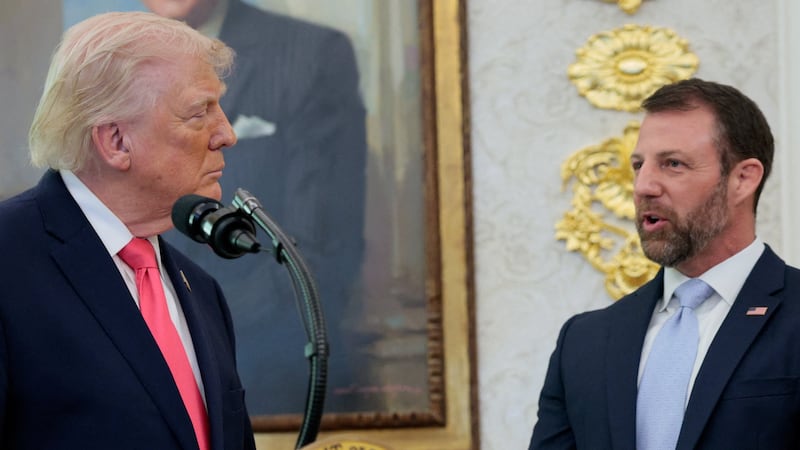 Markwayne Mullin stands next to U.S. President Donald Trump as he attends his swearing-in as Department of Homeland Security (DHS) Secretary, at the White House in Washington, D.C., U.S., March 24, 2026. REUTERS/Evan Vucci