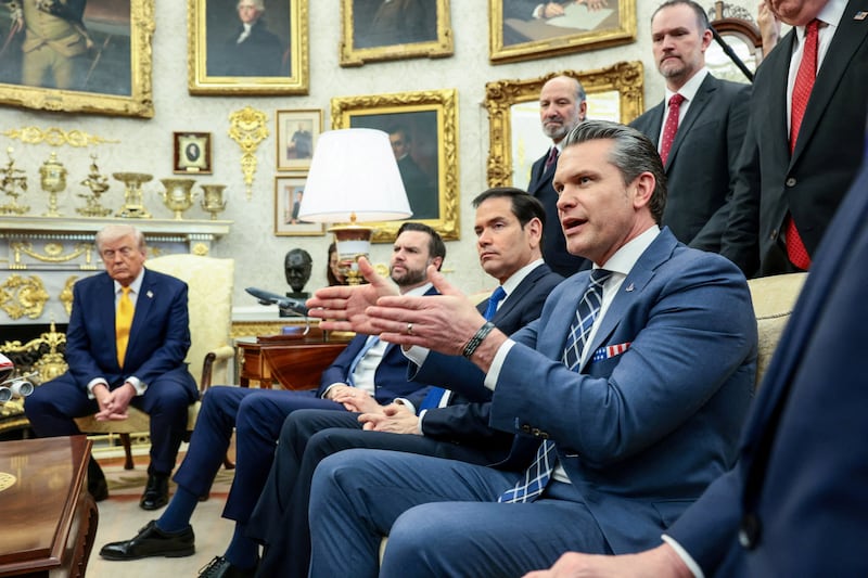 U.S. Defense Secretary Pete Hegseth speaks, with U.S. President Donald Trump, Vice President JD Vance, Secretary of State Marco Rubio, Commerce Secretary Howard Lutnick and Trade Representative Jamieson Greer listening next to him, during a meeting with Japanese Prime Minister Sanae Takaichi (not pictured) in the Oval Office at the White House in Washington, D.C., U.S., March 19, 2026. REUTERS/Evelyn Hockstein