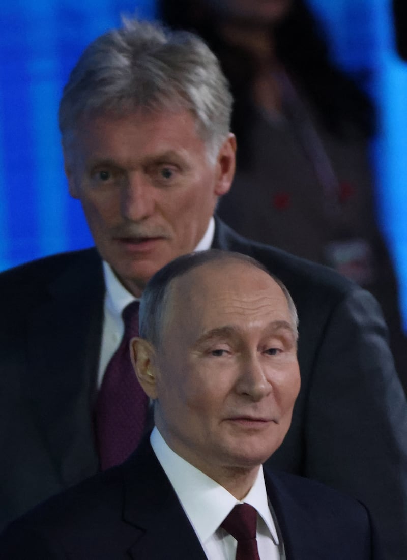 MOSCOW, RUSSIA - DECEMBER 19: Russian President Vladimir Putin (R) and his press secretary Dmitry Peskov (R) grimase during an annual joint call-in-show and press conference, on December 19, 2025 in Moscow, Russia. During the broadcast of "Direct Line With Vladimir Putin," the annual call-in-show and press conference, Russian President Vladimir Putin takes questions from journalists and citizens calling in from across Russia.  (Photo by Contributor/Getty Images)