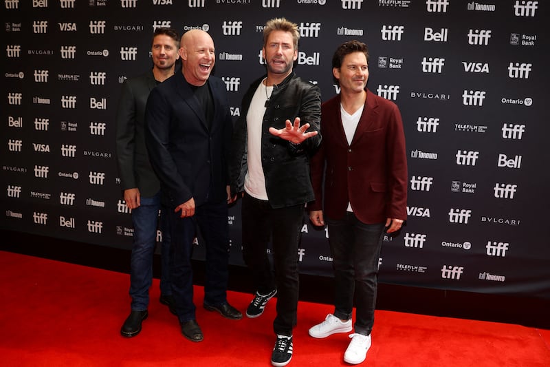 Band members Chad Kroeger (third from left), Michael Kroeger, Ryan Peake, and Daniel Adair pose during the gala presentation of Hate To Love: Nickelback at the Toronto International Film Festival (TIFF) in Toronto, Ontario, Canada, Sept. 8, 2023. REUTERS/Carlos Osorio