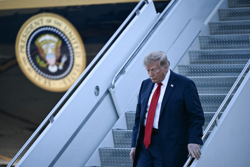US President Donald Trump steps off Air Force One upon arrival at Charlotte Douglas International Airport in Charlotte, North Carolina, on September 16, 2026. Trump is campaigning for Republican US Senate candidate Michael Whatley. (Photo by Brendan SMIALOWSKI / AFP via Getty Images)