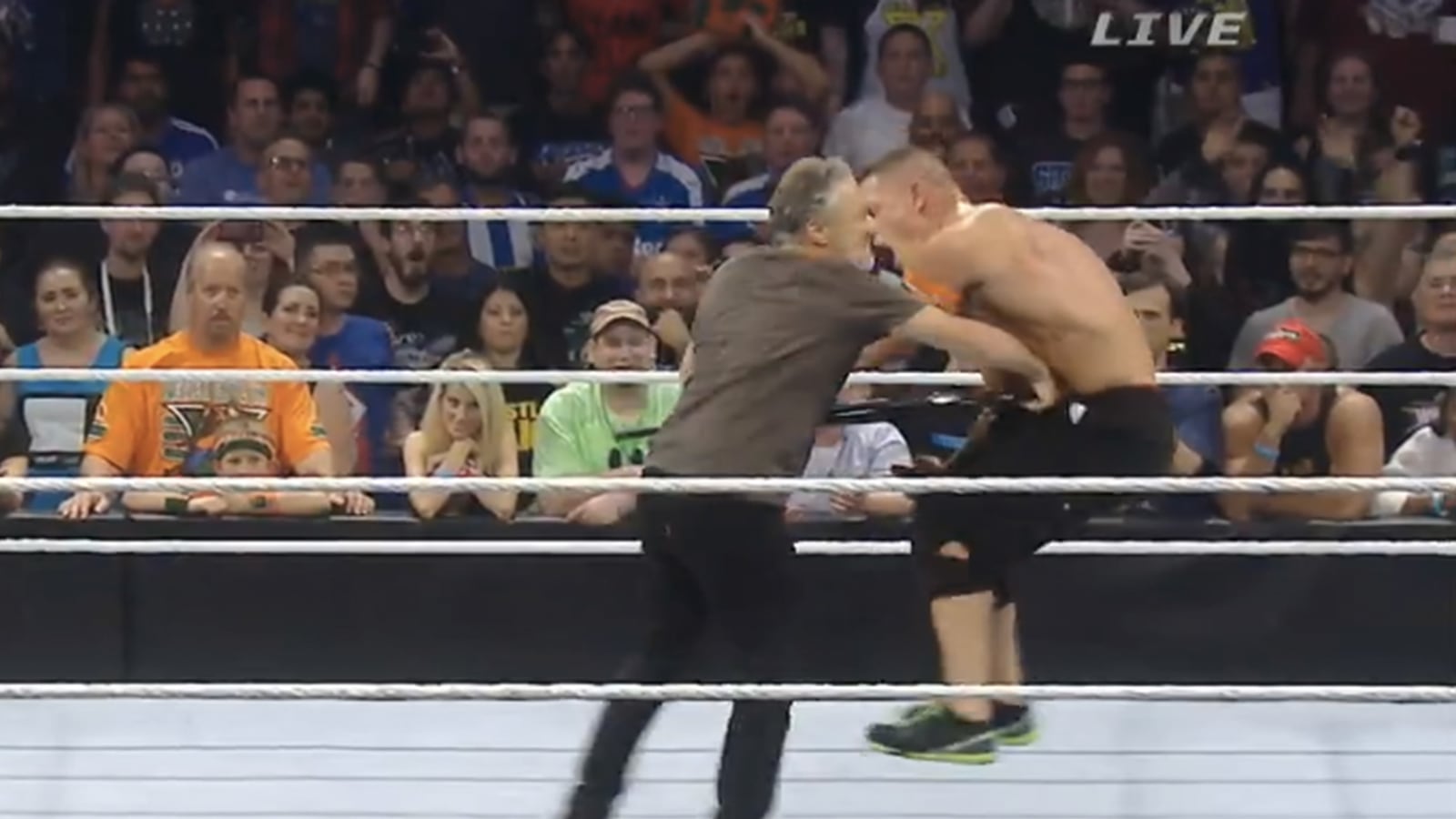 articles/2015/08/23/jon-stewart-kicks-ass-at-wwe-summerslam-bashes-john-cena-with-a-chair/150823-stern-wwe-stewart-tease_p88f3s