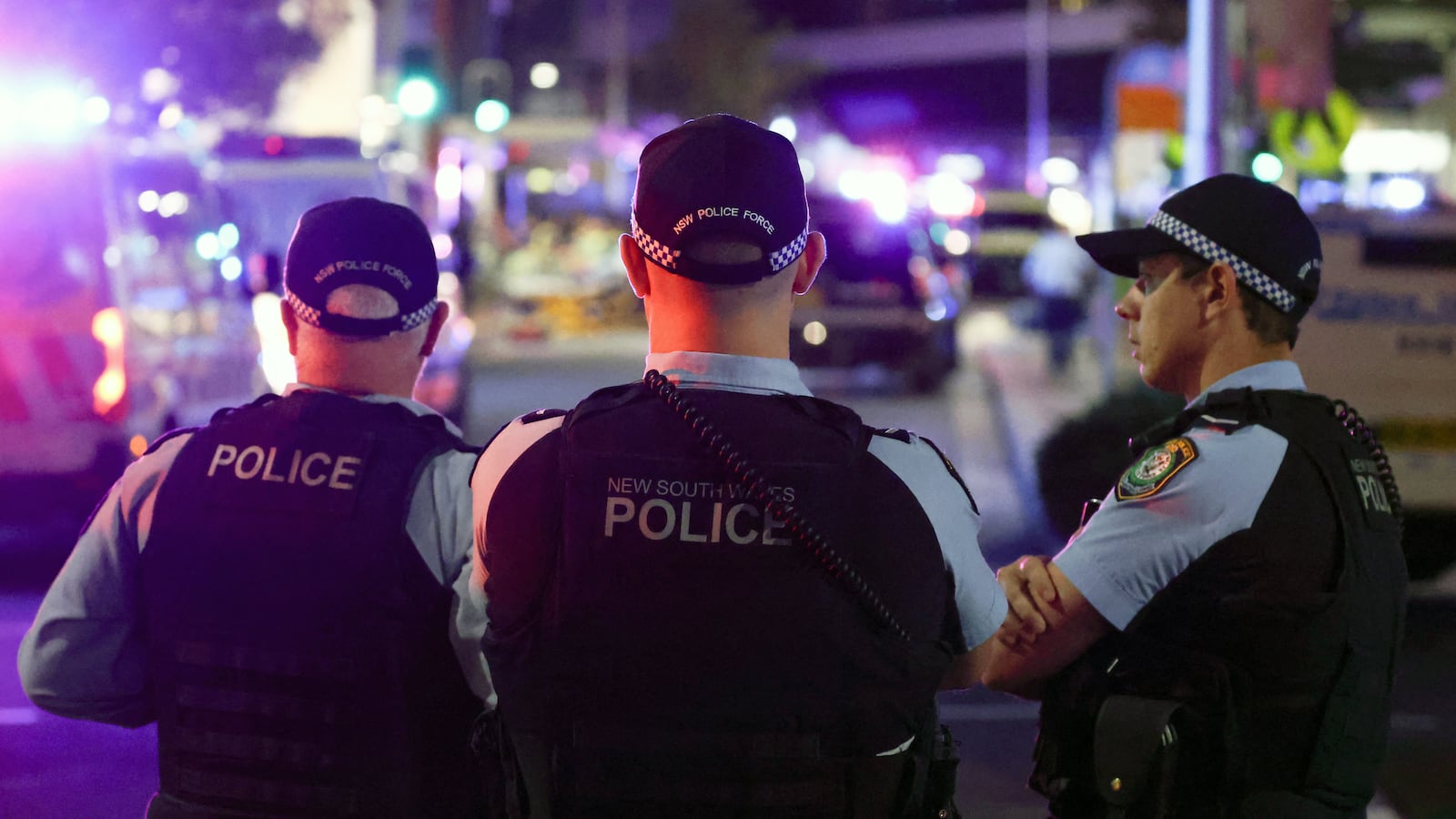 Police keep watch in front of the Westfield Bondi Junction shopping mall after a stabbing incident in Sydney on April 13, 2024.