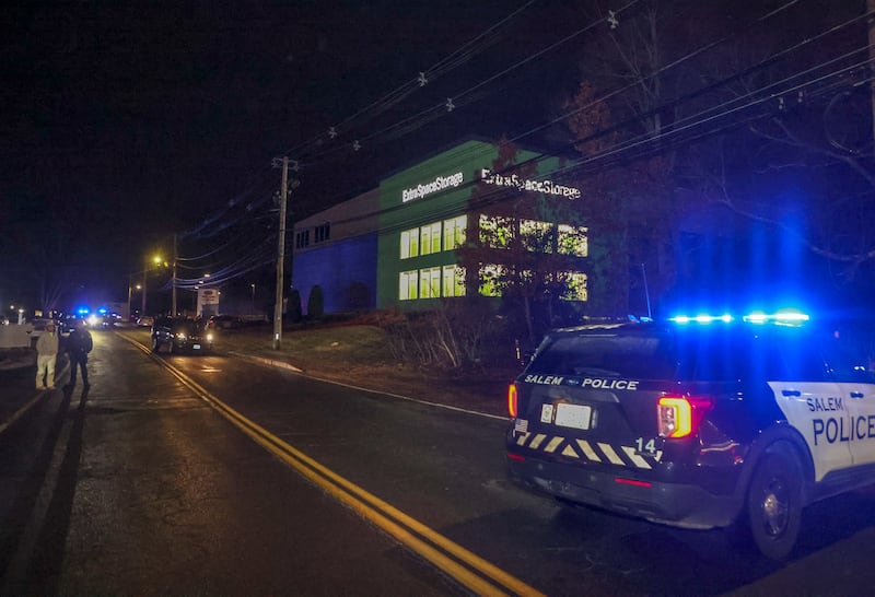Police on scene at the Extra Space Storage facility where the Brown University shooting suspect was found dead on December 18, 2025.