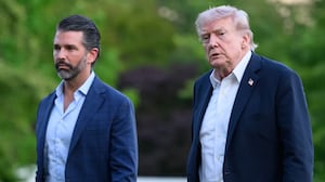 US President Donald Trump and Donald Trump Jr. walk on the south lawn toward the White House in Washington, DC, on May 3, 2026. Trump spent the weekend at his Mar-a-Lago resort in Palm Beach, Florida and his Doral Miami resort. (Photo by Mandel NGAN / AFP via Getty Images)