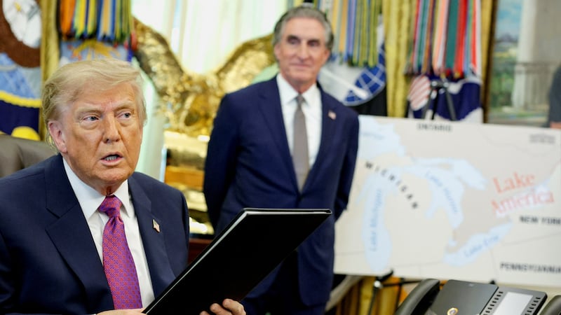 Donald Trump shows off an executive order renaming Lake Ontario as Lake America.