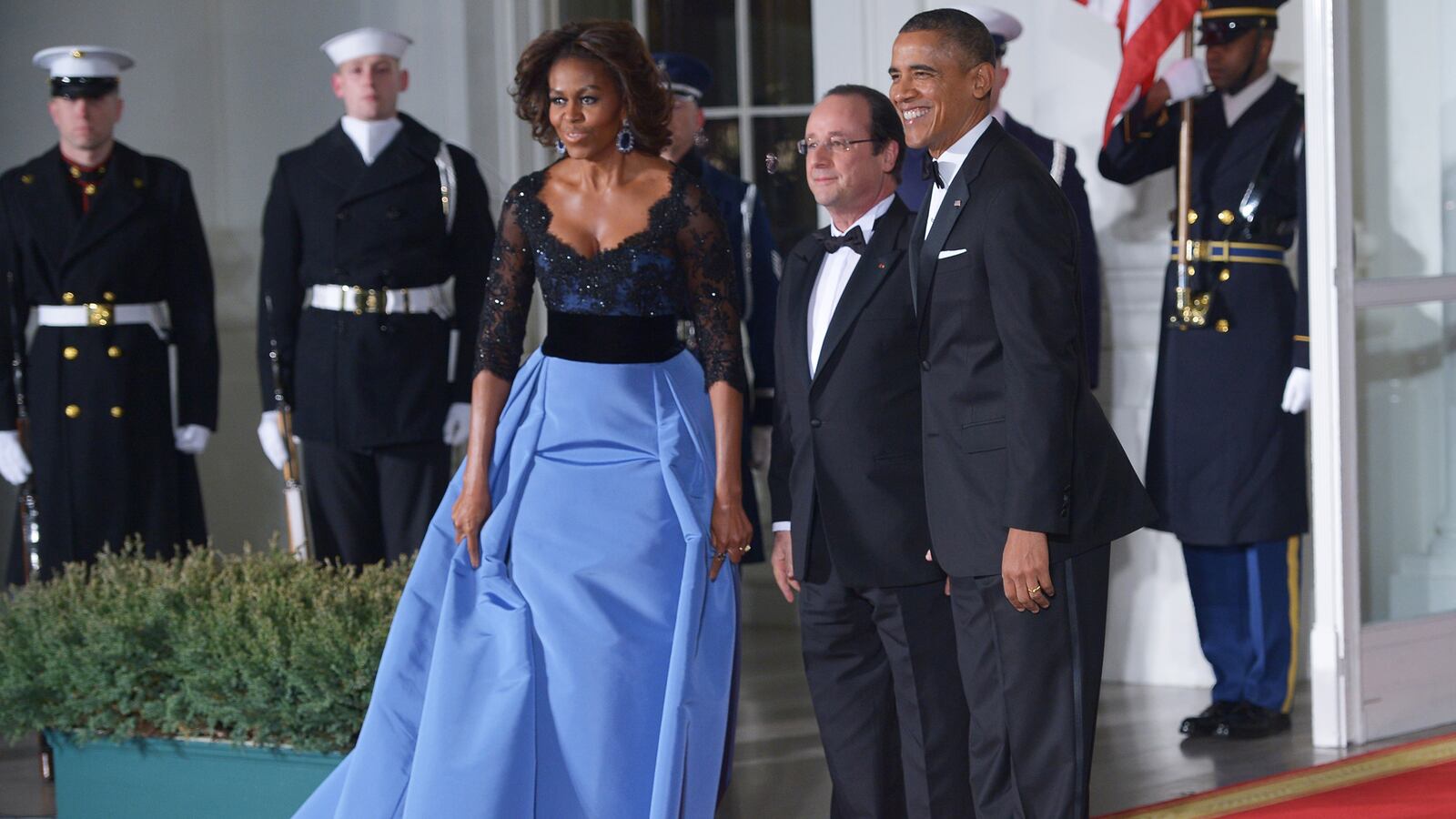 articles/2014/02/12/michelle-obama-wore-carolina-herrera-to-state-dinner-sports-illustrated-models-star-in-flight-safety-video/140212-mobama-obama-hollande-fashion_km9bme