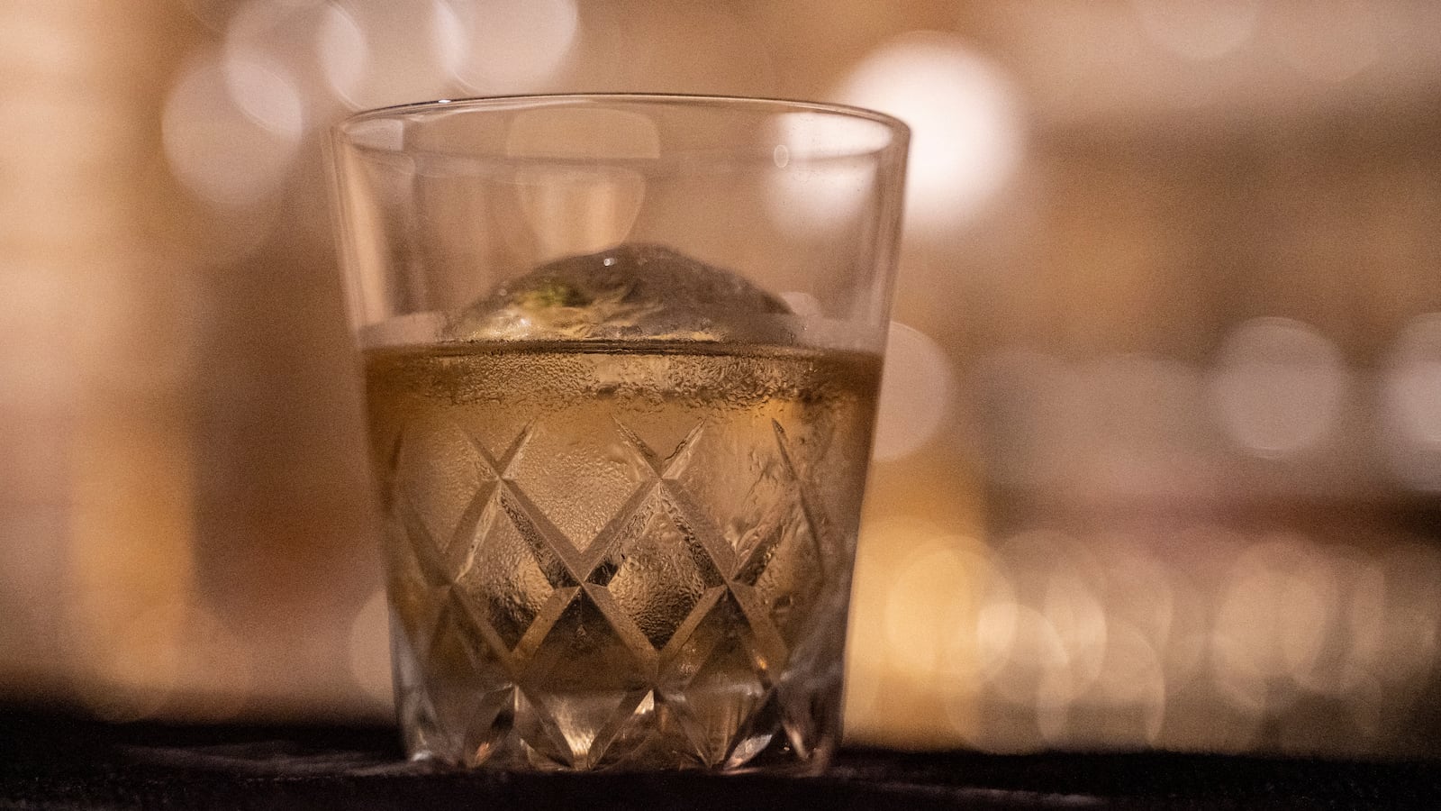 This photo taken on June 19, 2023 shows a glass of Yamazaki whisky, produced by Japanese beverage giant Suntory, sitting on the counter at the Tokyo Whisky Library bar at Minami Aoyama in Tokyo. Japan's Yamazaki distillery marks its 100th anniversary this year with plenty to celebrate, as the country's acclaimed aged whiskys command increasingly eye-watering prices thanks to growing demand and longstanding shortages. (Photo by Richard A. Brooks / AFP) / TO GO WITH Japan-beverage-whisky-suntory, FOCUS by Natsuko FUKUE (Photo by RICHARD A. BROOKS/AFP via Getty Images)