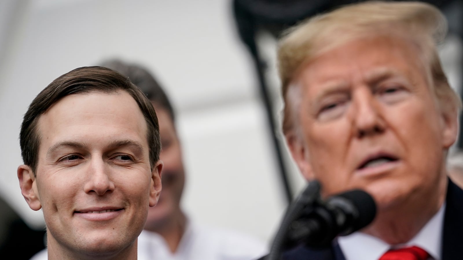 WASHINGTON, DC - JANUARY 29: (L-R) Senior Advisor Jared Kushner looks on as U.S. President Donald Trump speaks before signing the United States-Mexico-Canada Trade Agreement (USMCA) during a ceremony on the South Lawn of the White House on January 29, 2020 in Washington, DC. The new U.S.-Mexico-Canada Agreement (USMCA) will replace the 25-year-old North American Free Trade Agreement (NAFTA) with provisions aimed at strengthening the U.S. auto manufacturing industry, improving labor standards enforcement and increasing