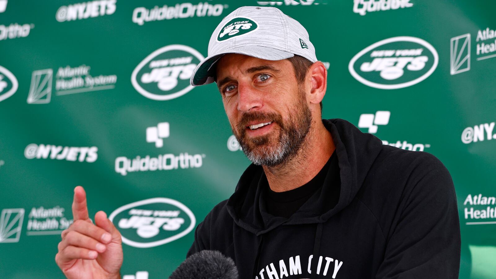 Quarterback Aaron Rodgers #8 of the New York Jets talks to reporters after training camp at Atlantic Health Jets Training Center on July 26, 2023 in Florham Park, New Jersey.