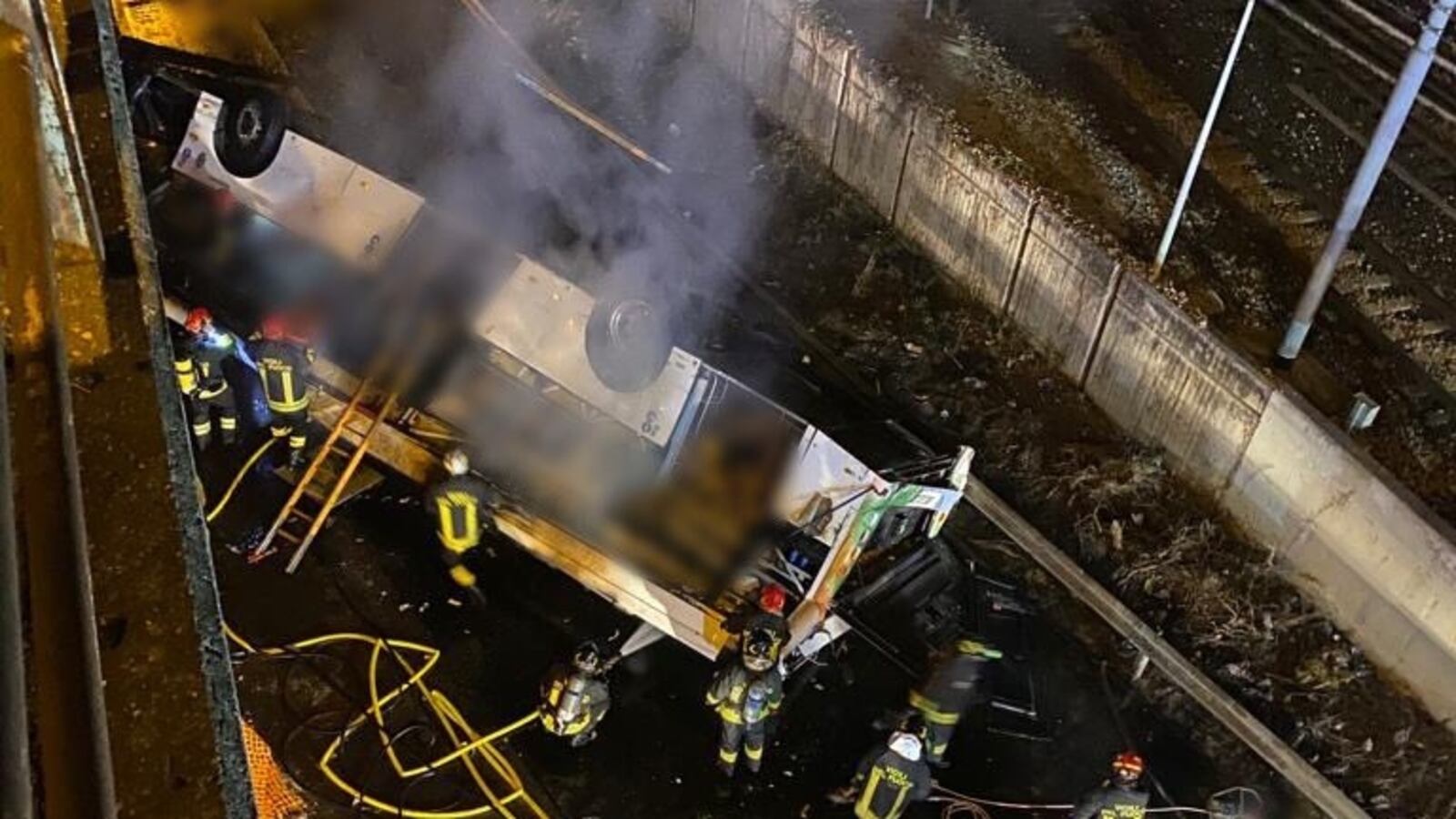 Aftermath of a bus falling off an overpass.