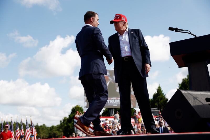 CHESAPEAKE, VIRGINIA - JUNE 28: Virginia Attorney General Jason Miyares joins Republican presidential candidate, former U.S. President Donald Trump onstage during a rally at Greenbrier Farms on June 28, 2024 in Chesapeake, Virginia. Last night Trump and U.S. President Joe Biden took part in the first presidential debate of the 2024 campaign.  (Photo by Anna Moneymaker/Getty Images)