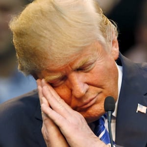 Donald Trump pretends to fall asleep (which he actually often does in Oval Office meetings) as he mocks a political opponent in a past presidential campaign.